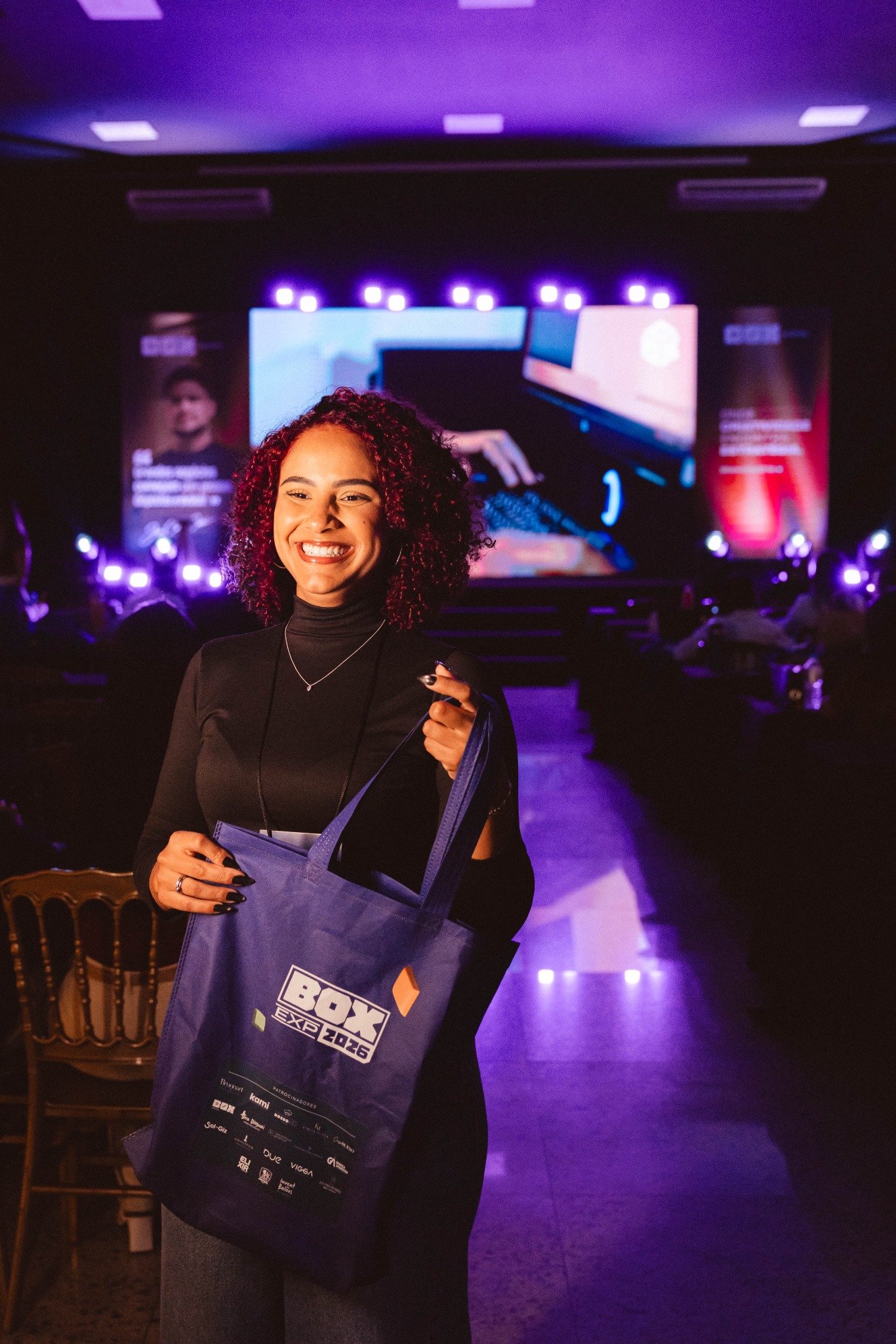 Participante sorrindo no Box Experience